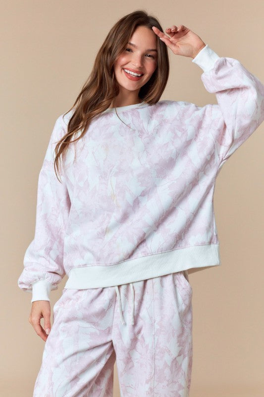 Sudadera rosa desteñido con hoja